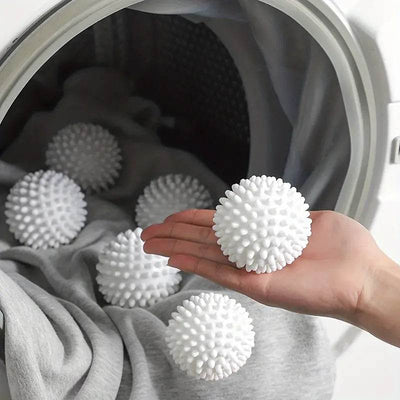 Reusable laundry balls inside washing machine.