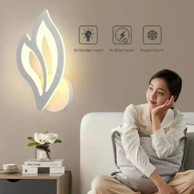 Elegant LED wall light in leaf shape, providing warm ambient lighting; ideal for LED wall decor in modern homes.