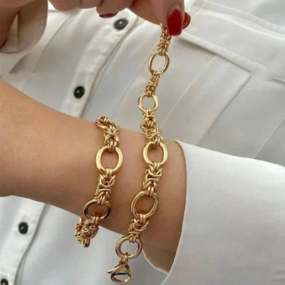 Gold chain bracelet with lobster-claw clasps for women.