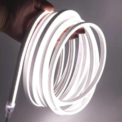 Flexible LED neon strip light with DC 12V, showing white illumination.