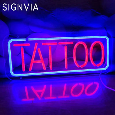 Neon "Tattoo" sign for wall decor, featuring vibrant blue and red colors, ideal for enhancing ambiance.