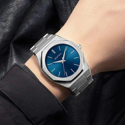 Luxury Smartwatch with stainless steel band and blue dial, worn on wrist.