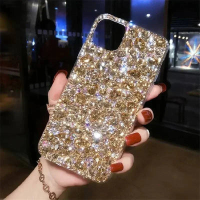 Glittering gold phone case with diamond-like design for iPhone, showcasing luxury and style.