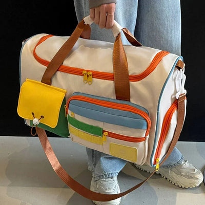 Colorful nylon travel backpack with zipper closure and various pockets, held by a person in casual attire.