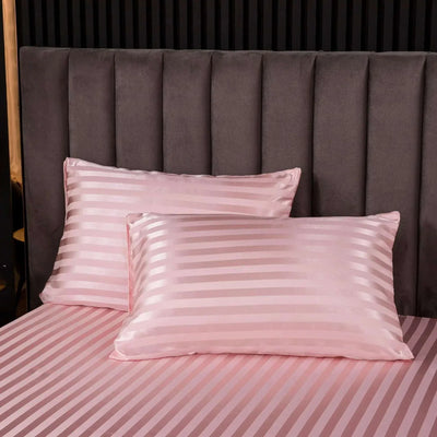 2-piece satin pillowcase set on a bed.